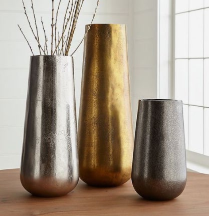 three metal vases